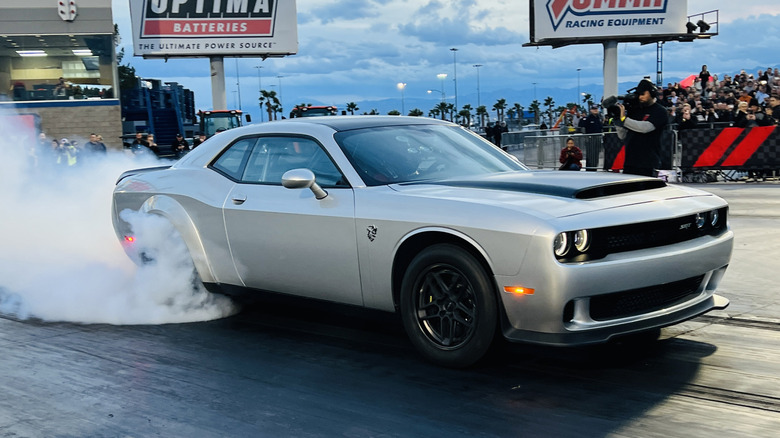 Dodge Demon 170 doing a burnout at a drag strip