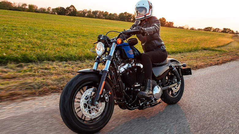 woman riding Harley-Davidson bike