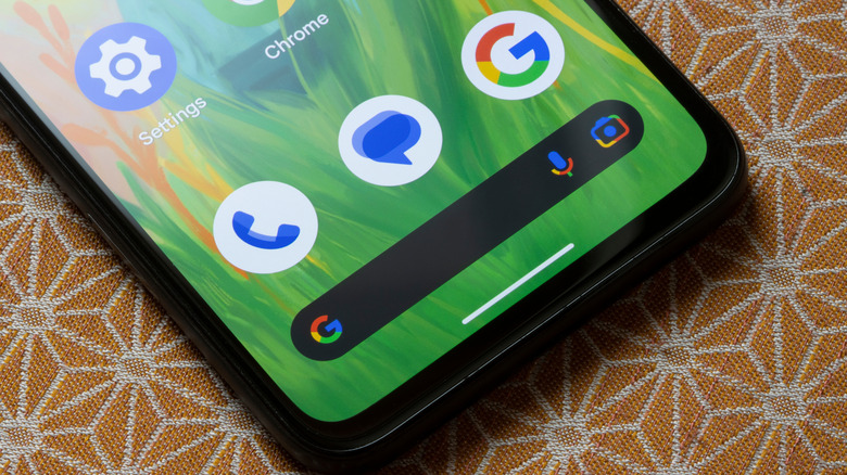 Cell phone with Phone, Messages, and Google icons at bottom of screen