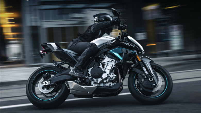 Person riding a CFMoto bike in the city
