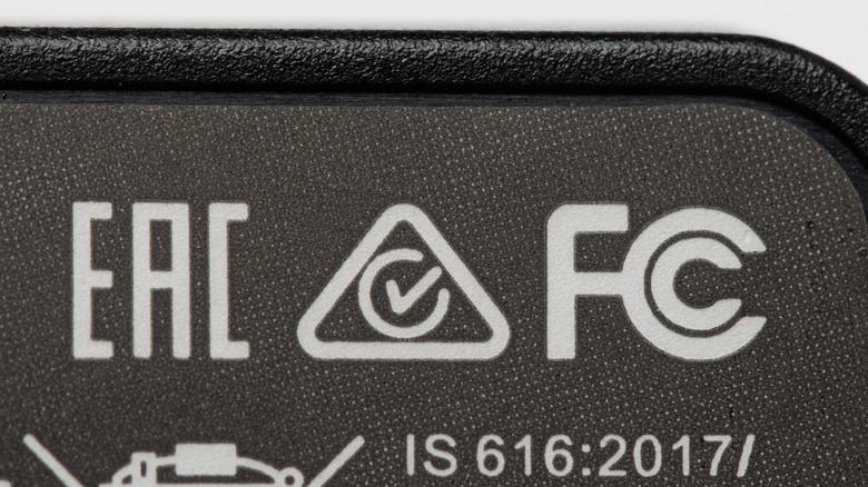 Close-up shot of an electronic with the Regulatory Compliance Mark on it