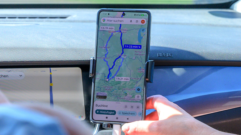 Driver using Google Maps in a car in Germany