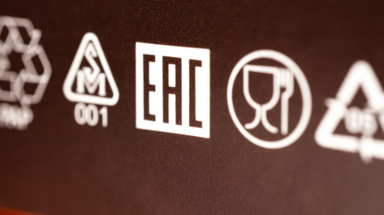 A close up of various compliance markings, including EAC