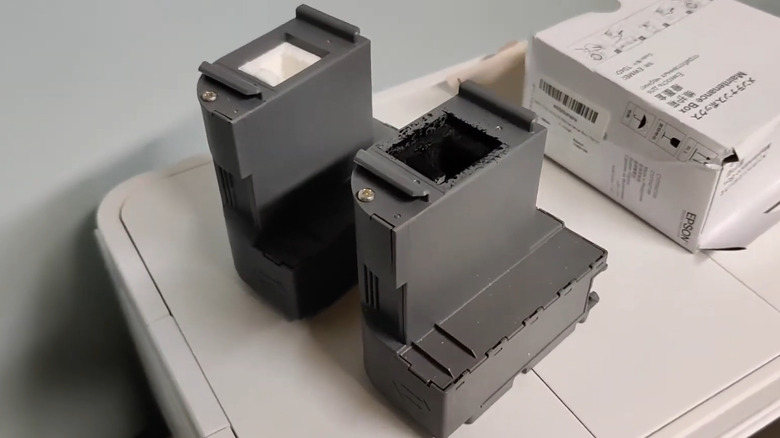 Old and new maintenance box on top of Epson printer