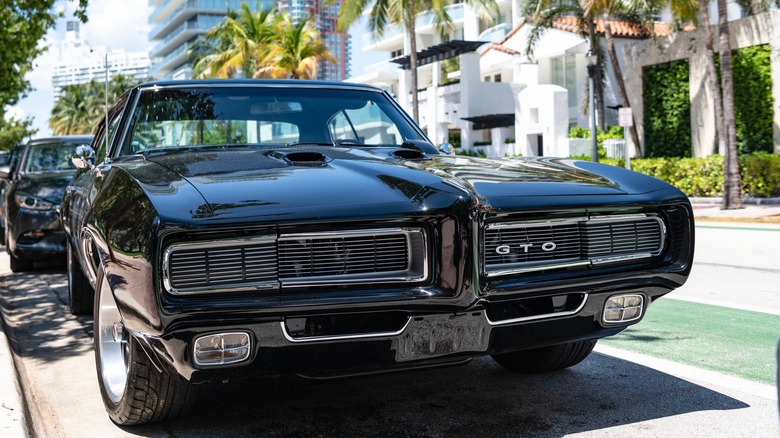 Black 1968 Pontiac GTO parked on street
