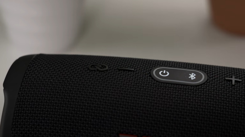Close up shot of the PartyBoost button on JBL portable speaker.