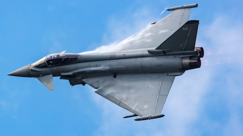 Eurofighter banking left as it flies with a blue sky in the background