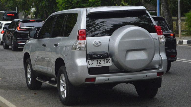 A gray Toyota Prado from back side