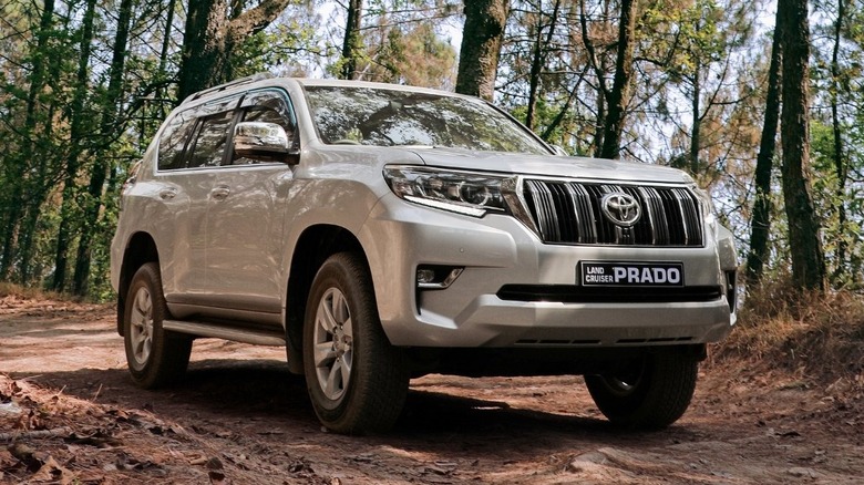 Fourth-gen Toyota Land Cruiser Prado driving in the woods