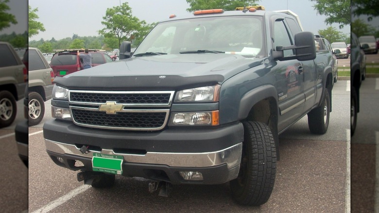 A 2006 Chevy Silverado 2500HD pickup truck parked in a parking space.