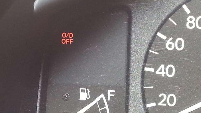 O/D Off indicator light on the instrument panel of an older car