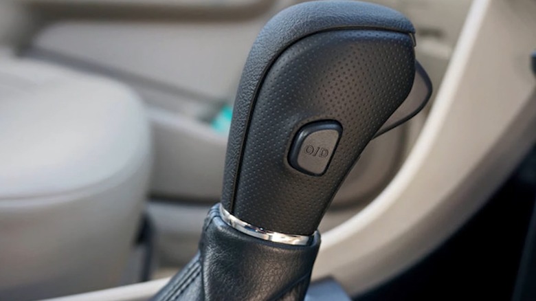 the overdrive button on the gear selector of an older car