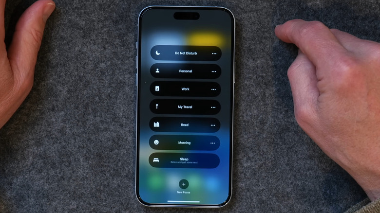 iPhone on a desk showing focus profiles