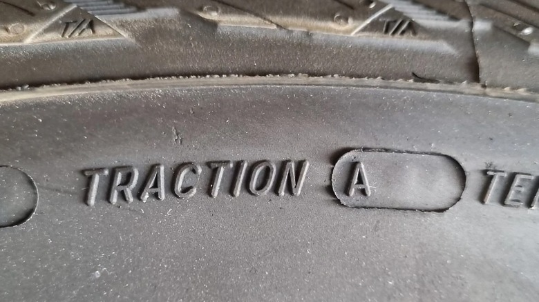 a tire sidewall with traction rating A printed on it