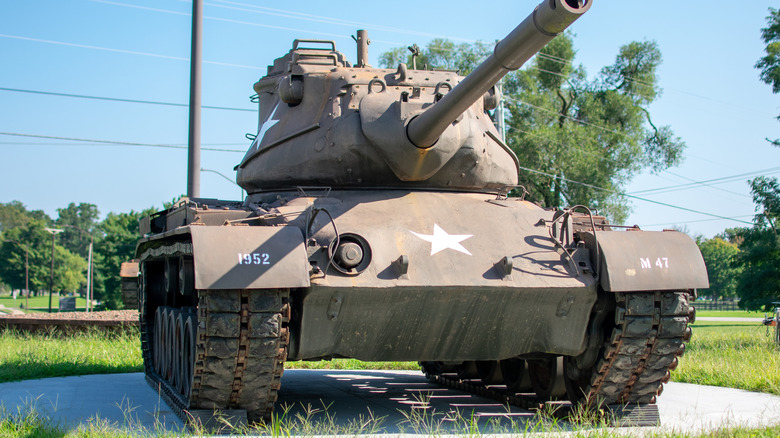 A tank on display outside.