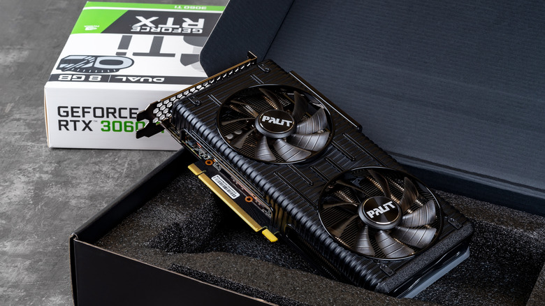 A Nvidia GeForce RTX 3060 Ti GPU being unboxed.