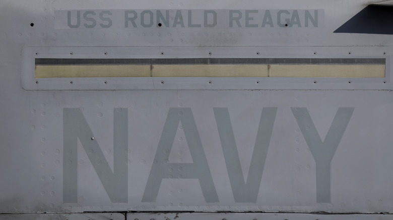 The side of a USS navy ship signage