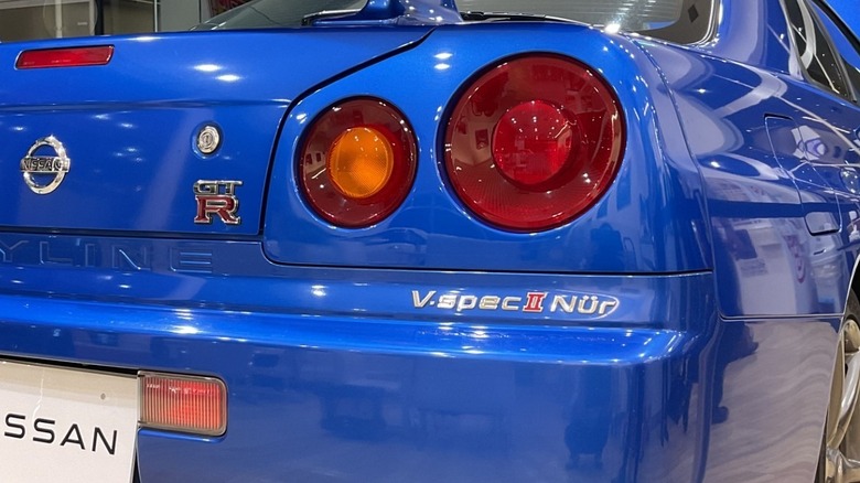Closeup of rear-right quarter panel of 2002 Nissan Skyline R34 GT-R V-Spec II Nür showing 