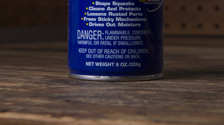 A can of WD-40 in a workshop.