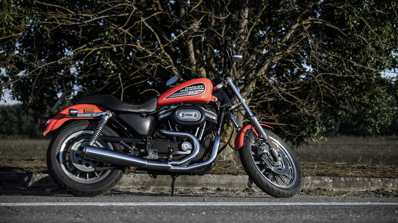 Orange Harley-Davidson 883 Sportster parked