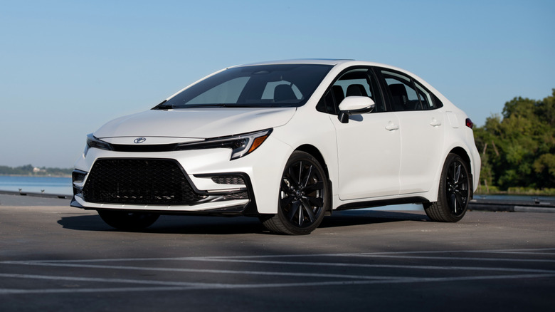 A white 2025 Corolla XSE parked on asphalt
