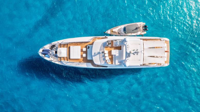 Aerial view of a luxury yacht in the ocean.