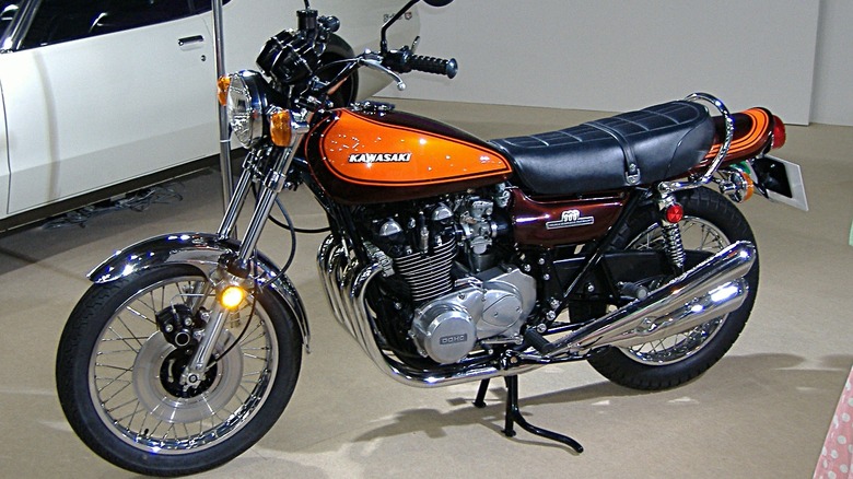 An orange and black Kawasaki Z1 on display