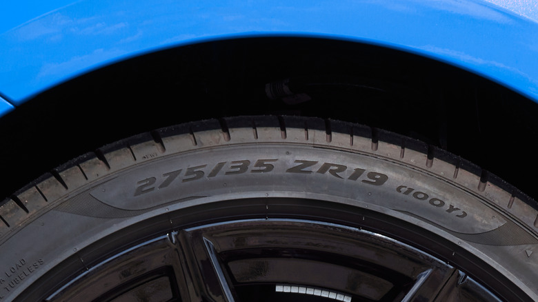 ZR markings on a tire installed in a blue car