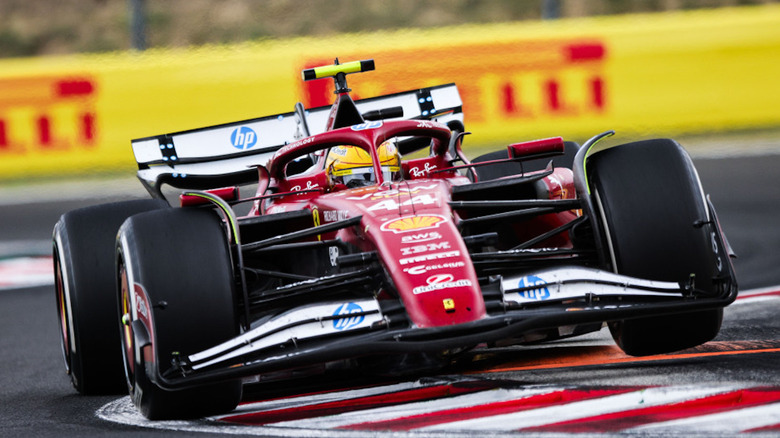 Front view of Lewis Hamilton driving Ferrari SF-25 car