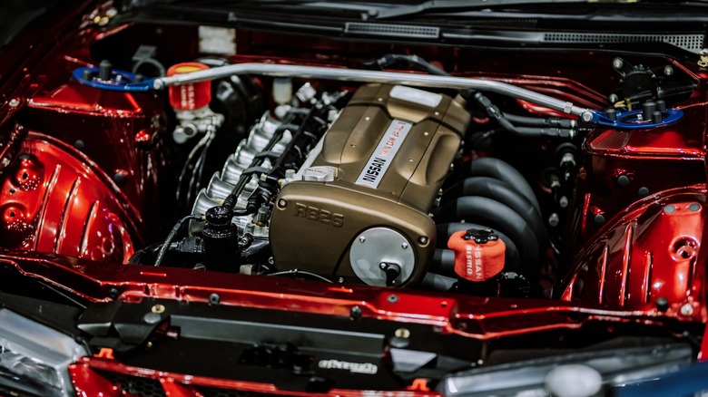 An RB26 engine under the hood of an unidentified car