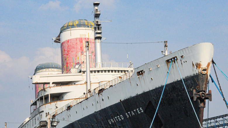 The SS United States towers overhead, showing off its distinctive bow