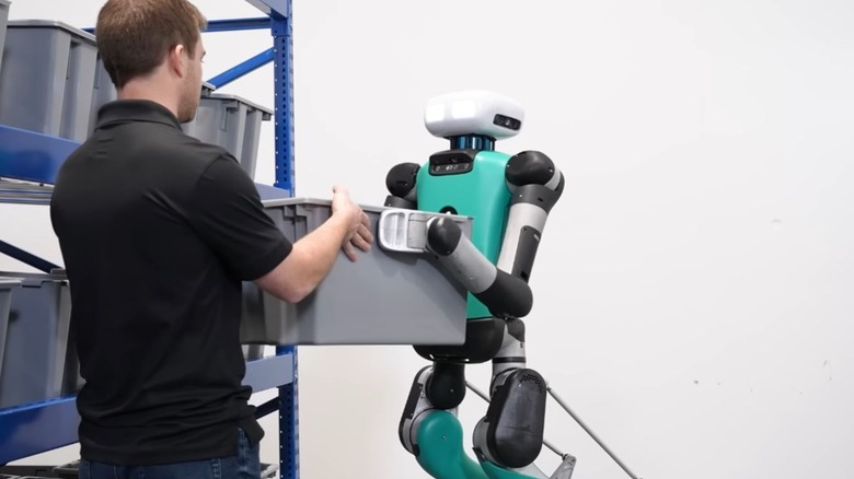 Digit robot presenting box to person