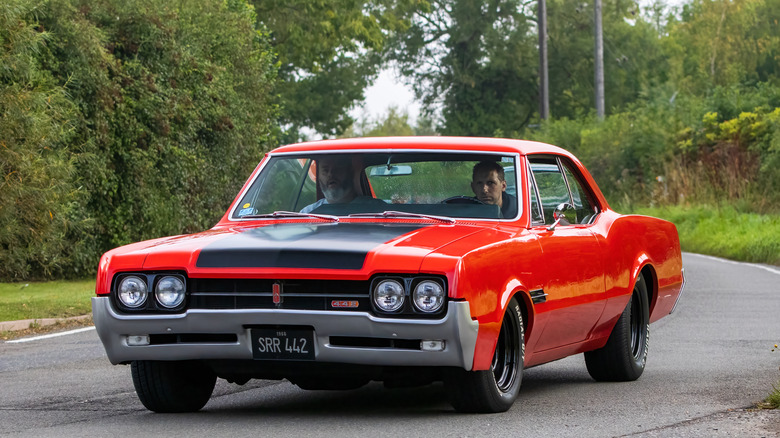 Vintage Oldsmobile red General Motors GM car sedan