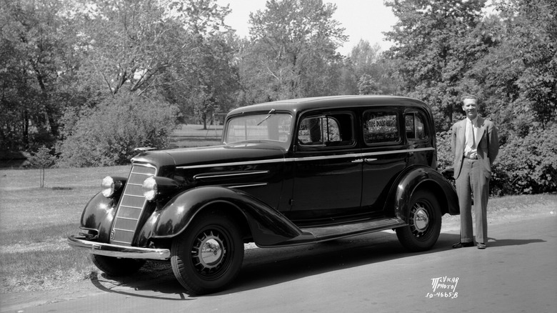 Ray Perkins with Oldsmobile Sedan in 1934