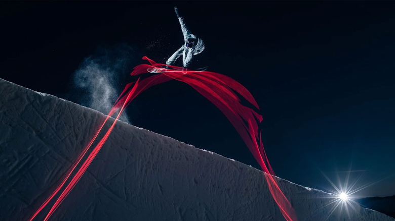ActionGlow snowboarder fazendo truque