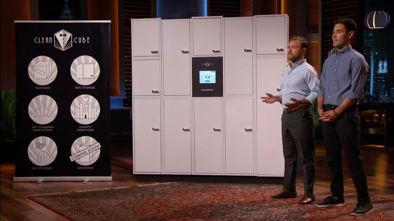 Arthur and Ryan standing next to Clean Cube display on Shark Tank