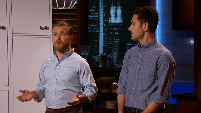 Arthur talking next to Ryan on Shark Tank