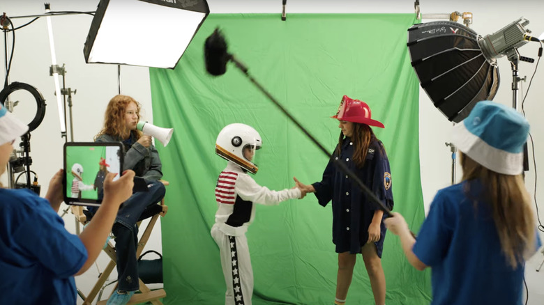 Creator Camp kids shooting green-screen video
