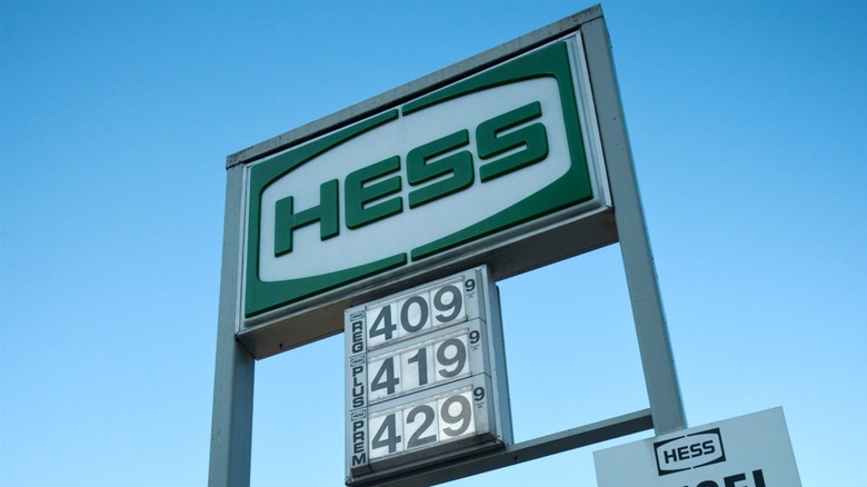 Hess gas station sign against a clear blue sky