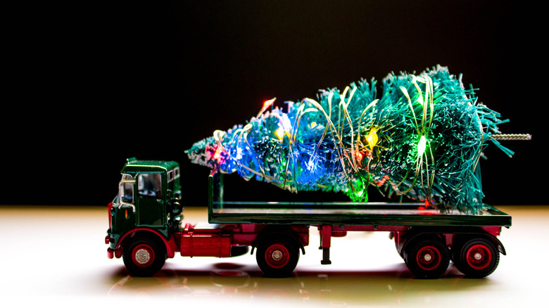 Hess toy truck with model Christmas tree on back