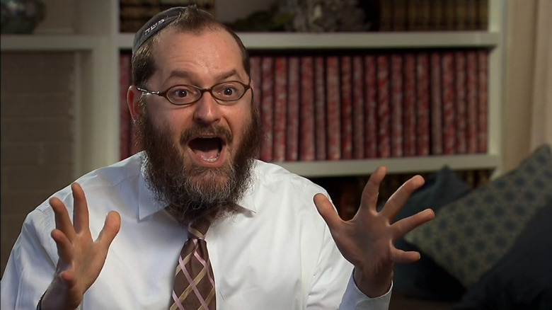 Moshe excitingly expressing in an interview