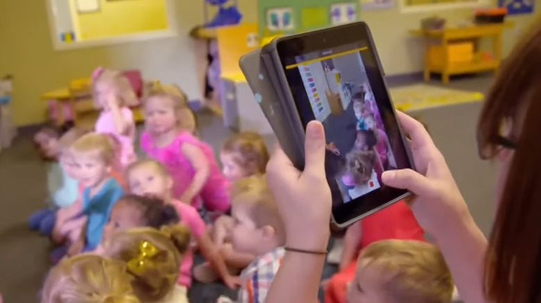 Teacher taking video of students