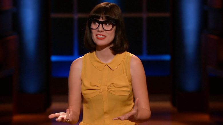 Amy looking to the side while speaking on Shark Tank
