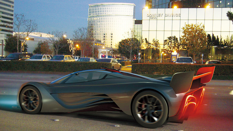 Mazda Furai on public road in front of office buildings, left-side view
