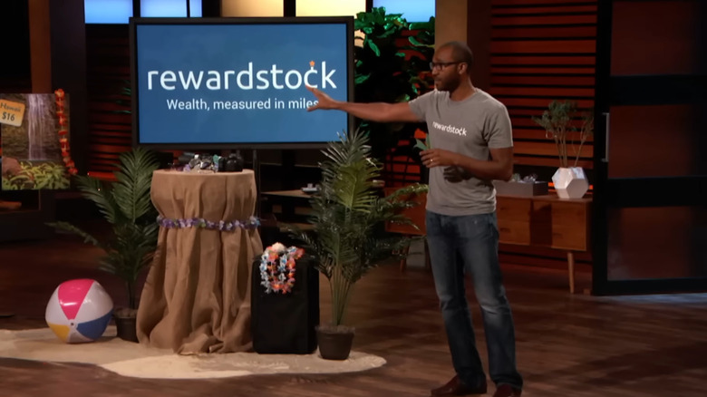 Jon talking next to RewardStock display on Shark Tank