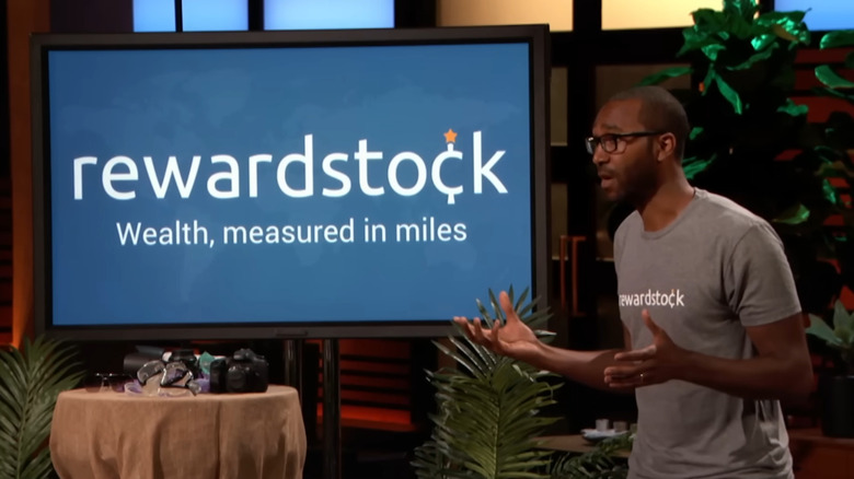 Jon talking next to RewardStock display on Shark Tank