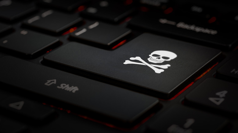 Close-up of a skull and crossbones on a keyboard's Enter key