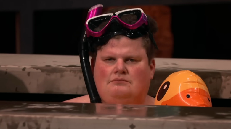 Jesse looking at camera while in pool with a sour expression on Shark Tank