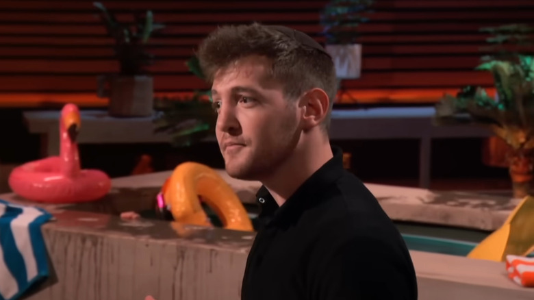 Bunim standing next to pool display while presenting on Shark Tank