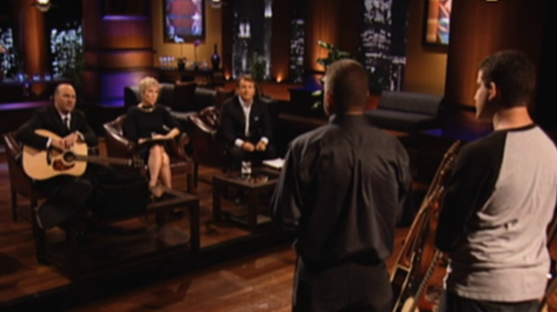 Jeff and Josh talking to the sharks while Kevin holds guitar